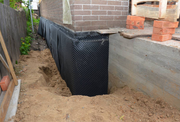 SJ Waterproofing Pros technician performing targeted Waterproofing assessment in Greensboro, GA